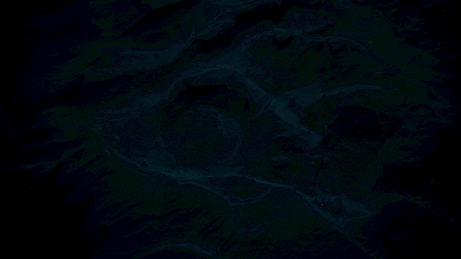A dark, watery surface with swirling waves and faint glints, like a deep ocean at night.